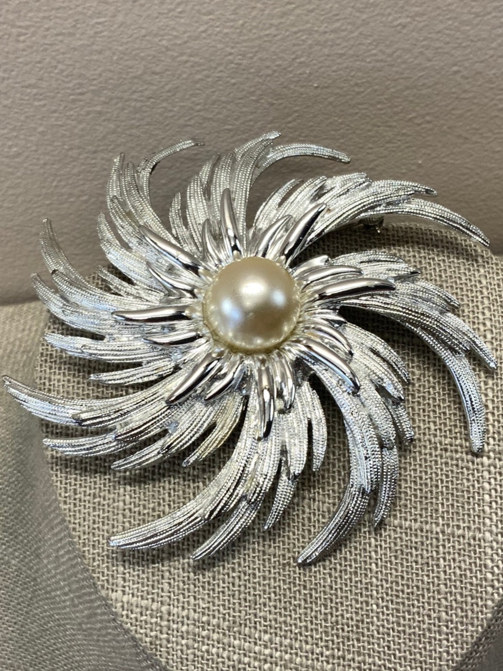 Sarah Coventry "Pinwheel" brooch. 3”.  1960s, silver-tone, faux pearl center